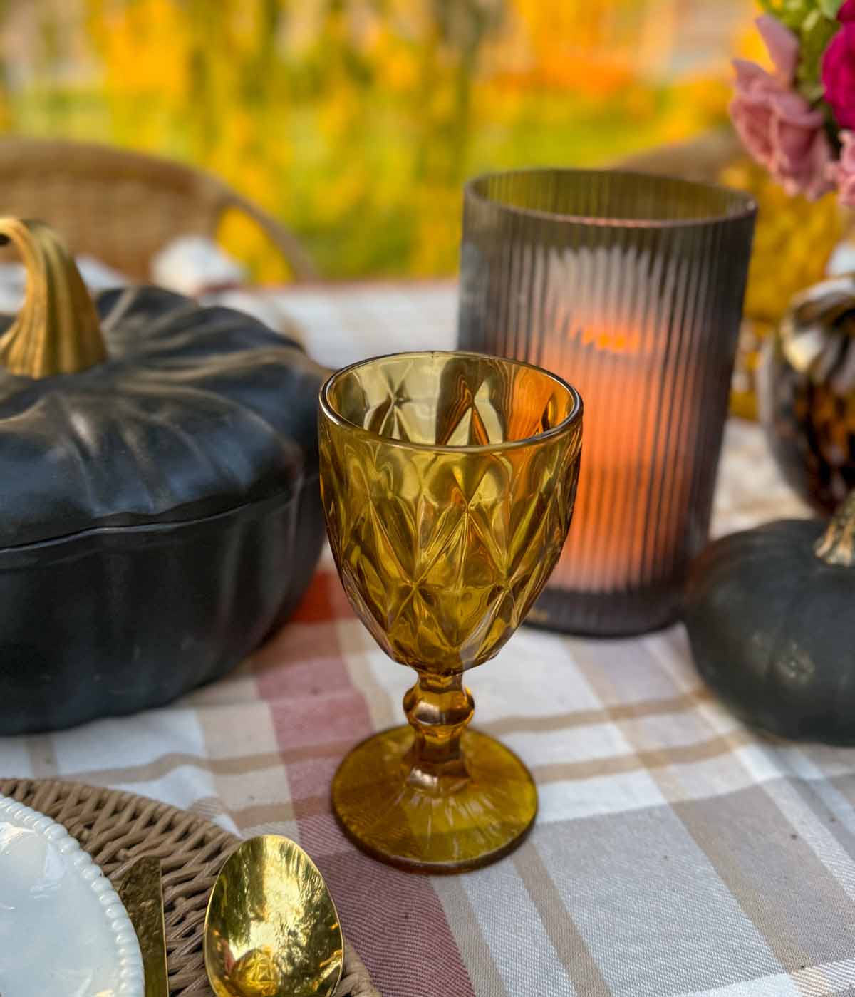 Gorgeous amber goblet on entertaining expert, Candie Anderson's elegant outdoor fall tablescape.