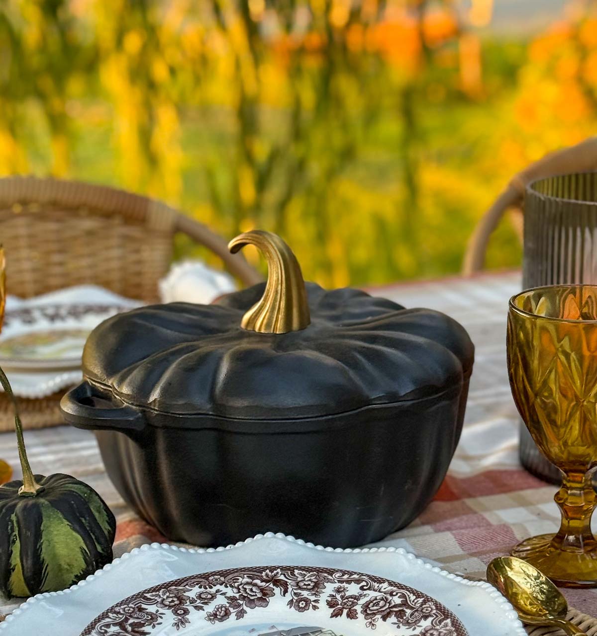 This gorgeous trending black pumpkin Dutch oven looks great on entertaining expert, Candie Anderson's fall tablescape.