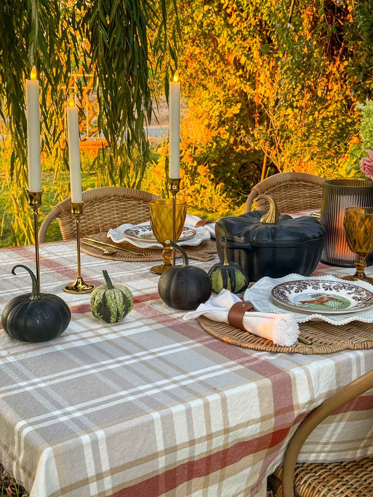 Gorgeous tapered brass candlestick holders and battery operated tapered candles on entertaining expert, Candie Anderson's elegant fall tablescape.