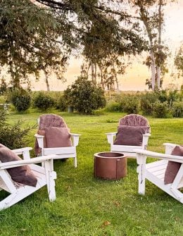 Lifestyle expert, Candie Anderson shares her white foldable Adirondack chairs and fire pit that are a part of the Wayfair Way Day Sale.
