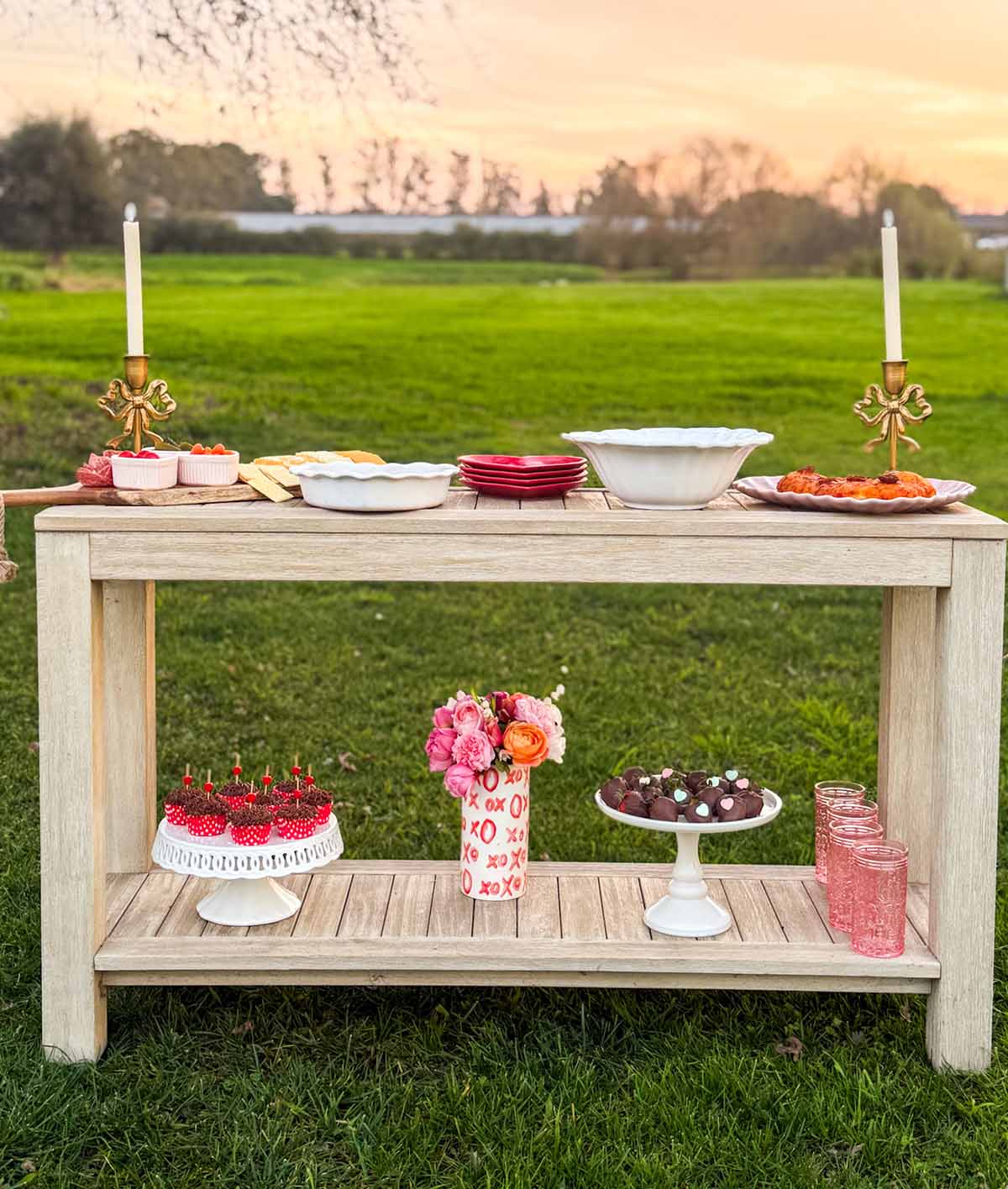 Entertaining expert, journalist and lifestyle blogger Candie Anderson of candieanderson.com shares her beautiful Valentine's Day console table filled with delicious homemade appetizers, a heart shaped pizza, gold bow candles, decadent desserts, beautiful flowers, a charcuterie board and more.