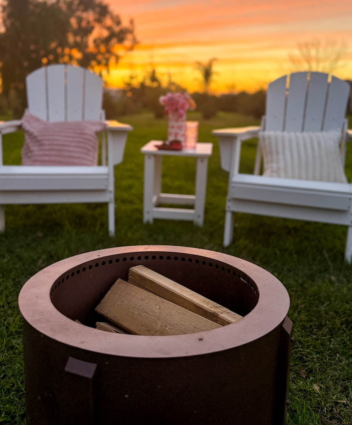 Lifestyle expert, journalist and entertaining blogger Candie Anderson of candieanderson.com shares how she threw a cozy Valentine's Day party with white Adirondack chairs, a round smokeless fire pit, delicious food, drinks and beautiful flowers!