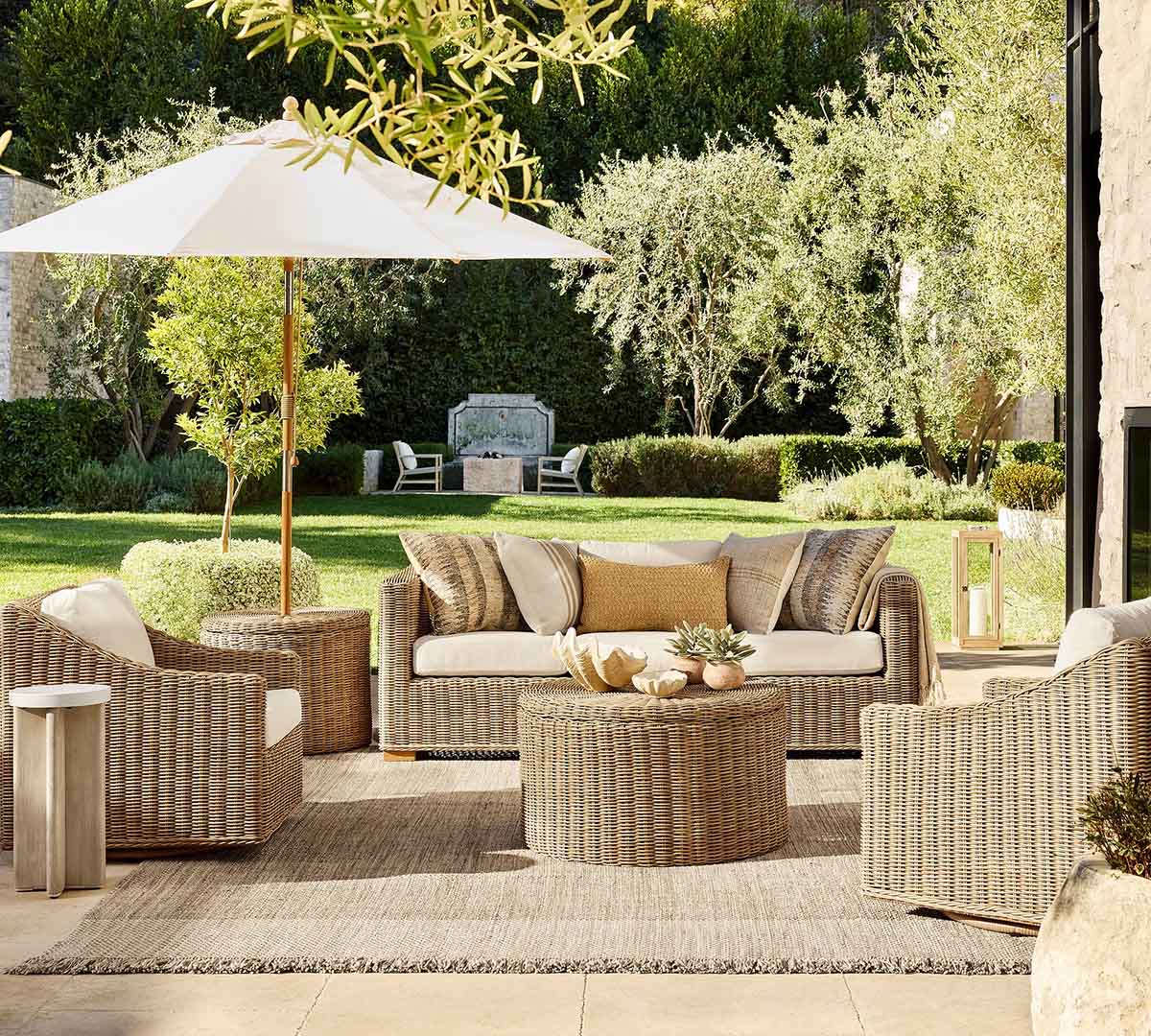 Pottery Barn Huntington Slim Slope Arm Swivel Outdoor Lounge Chair Natural best outdoor wicker swivel chairs