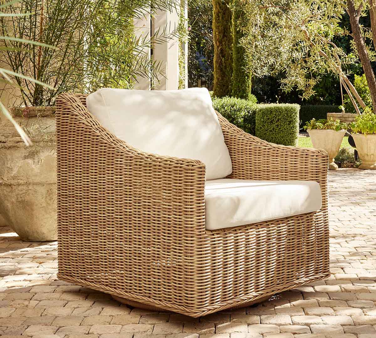 Pottery Barn Huntington Slim Slope Arm Swivel Outdoor Lounge Chair Natural best outdoor wicker swivel chairs