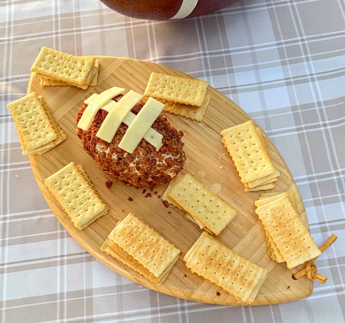 Entertaining expert, journalist and lifestyle blogger Candie Anderson of candieanderson.com shares a closeup of her football charcuterie board with club crackers and a Boursin cheese football.