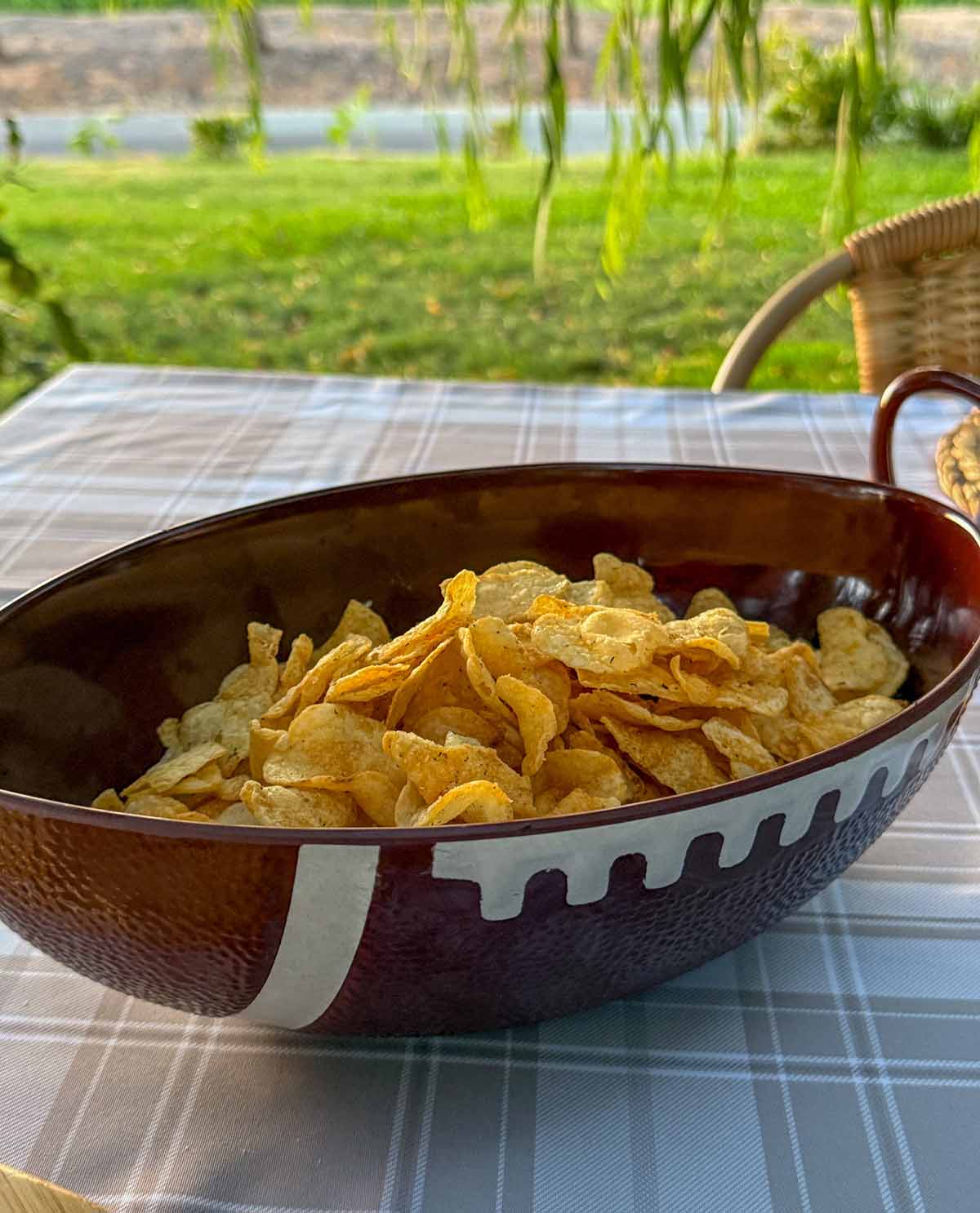 Lifestyle expert, journalist, football fan and lifestyle blogger Candie Anderson of candieanderson.com shares her football shaped serving bowls which she filled with dill pickle flavored kettle chips.