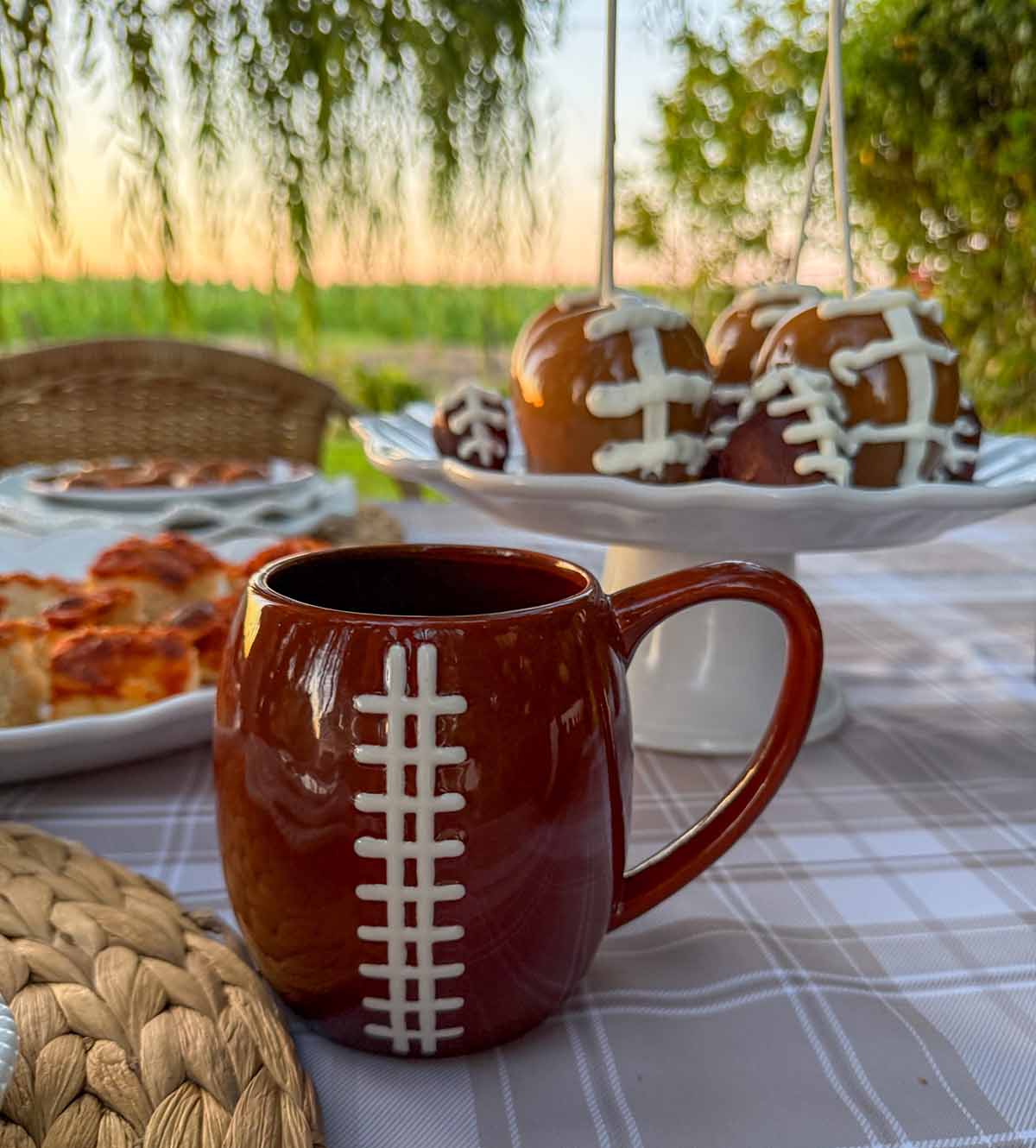Entertaining expert, journalist and lifestyle blogger Candie Anderson of candieanderson.com shares the Godinger football mugs she featured on her tailgate tablescape.