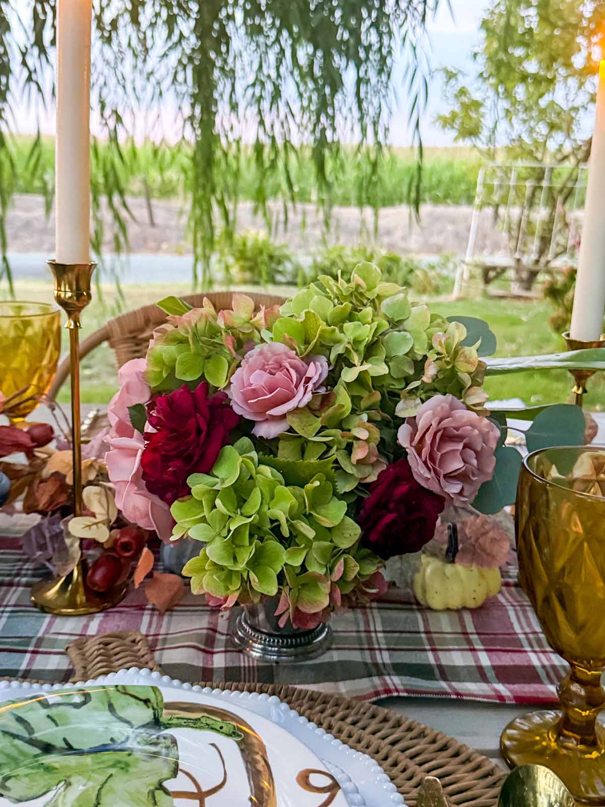 Entertaining expert, journalist and lifestyle blogger Candie Anderson of candieanderson.com shares the beautiful fall inspired garden bouquet she and her mom made using Koko Loko roses, green hydrangeas, Southern magnolia leaves and more from her flower farm. They placed them in silver mint julep cups. This is the perfect heritage floral bouquet for any tablescape!