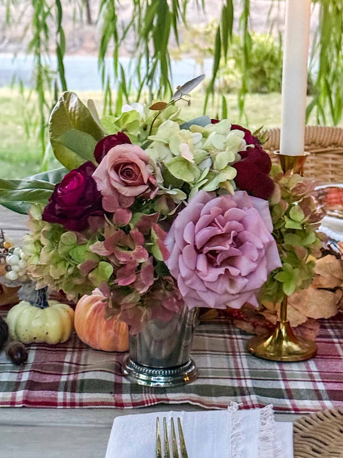 Entertaining expert, journalist and lifestyle blogger Candie Anderson of candieanderson.com shares the beautiful fall inspired garden bouquet she and her mom made using Koko Loko roses, green hydrangeas, Southern magnolia leaves and more from her flower farm. They placed them in silver mint julep cups.
