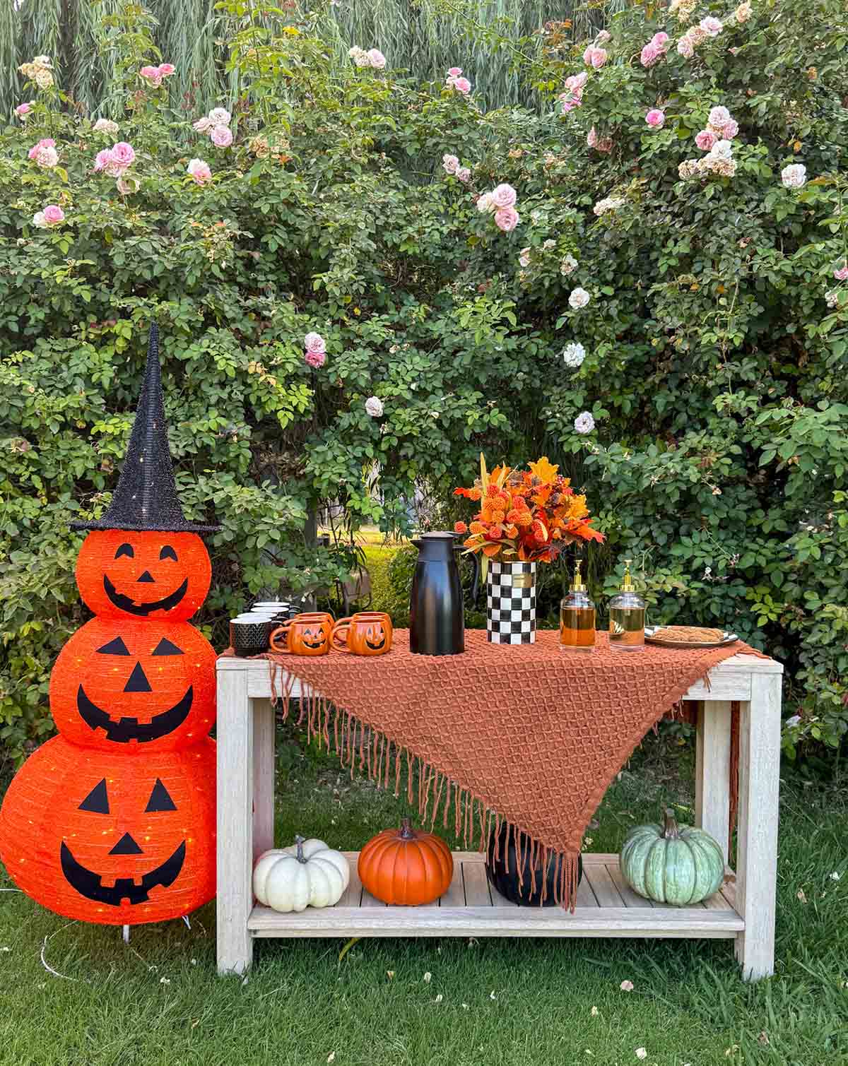 Entertaining expert, journalist and lifestyle blogger Candie Anderson shares how she decorated her outdoor console table for her Halloween party! She transformed it into a coffee bar alongside a 5 ft tall light up jackolantern!