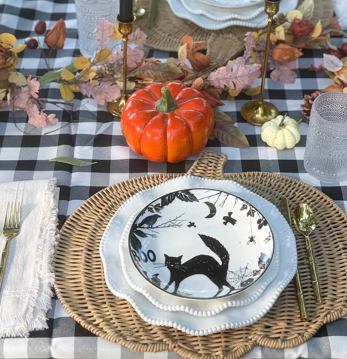 Entertaining expert, journalist and lifestyle blogger Candie Anderson of candieanderson.com shares how she created her Halloween tablescape with a rattan pumpkin shaped placemat, neutral Perlette dining plates and Halloween salad plates.