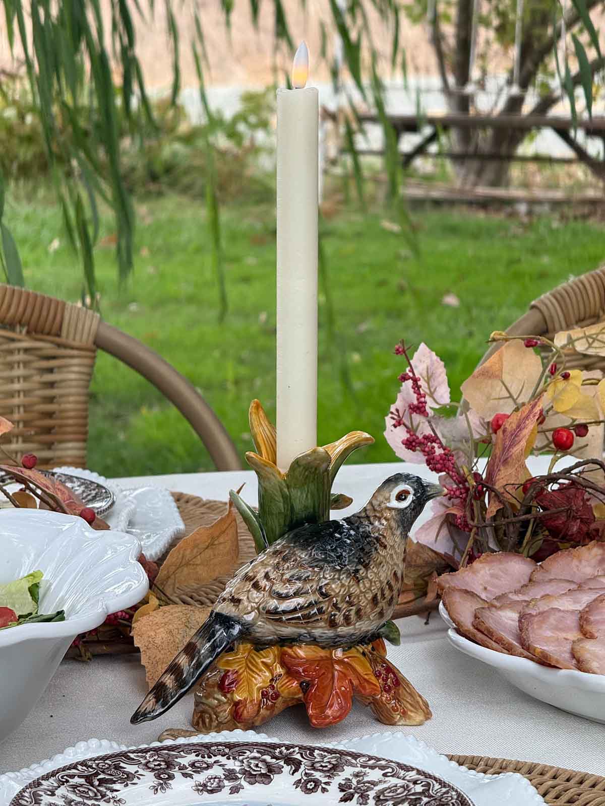 Entertaining expert, journalist and lifestyle blogger Candie Anderson of candieanderson.com shares how she created her beautiful Thanksgiving tablescape with Fitz and Floyd Fall Harvest Pheasant Candleholders and battery powered LED taper candles.