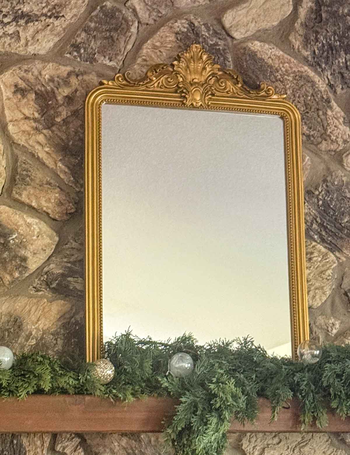 Entertaining expert, journalist and lifestyle blogger Candie Anderson of candieanderson.com shares her gorgeous gold baroque vintage gold mirror! It is perfect on her classic Christmas fireplace mantel.