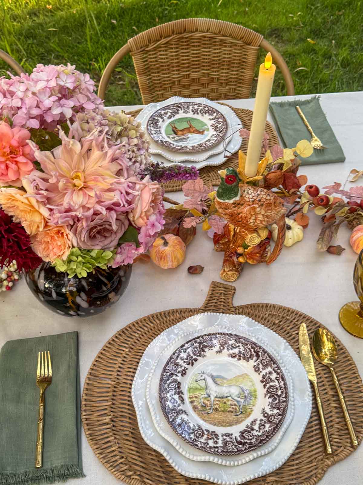 Entertaining expert, journalist and lifestyle blogger Candie Anderson of candieanderson.com shares a closeup of her Thanksgiving tablescape! You'll love the horse plates, the pheasant candleholders, the tortoise shell vase with garden roses and dahlias and hydrangeas and more.