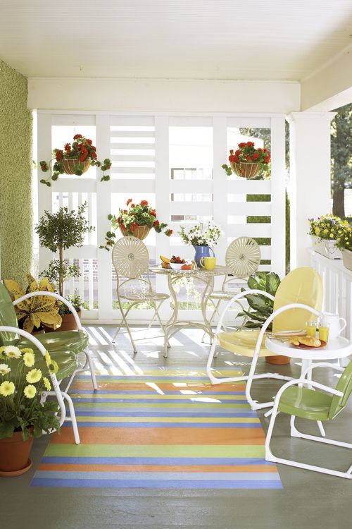 Button Vintage Metal Chairs With A Painted Patio Rug 